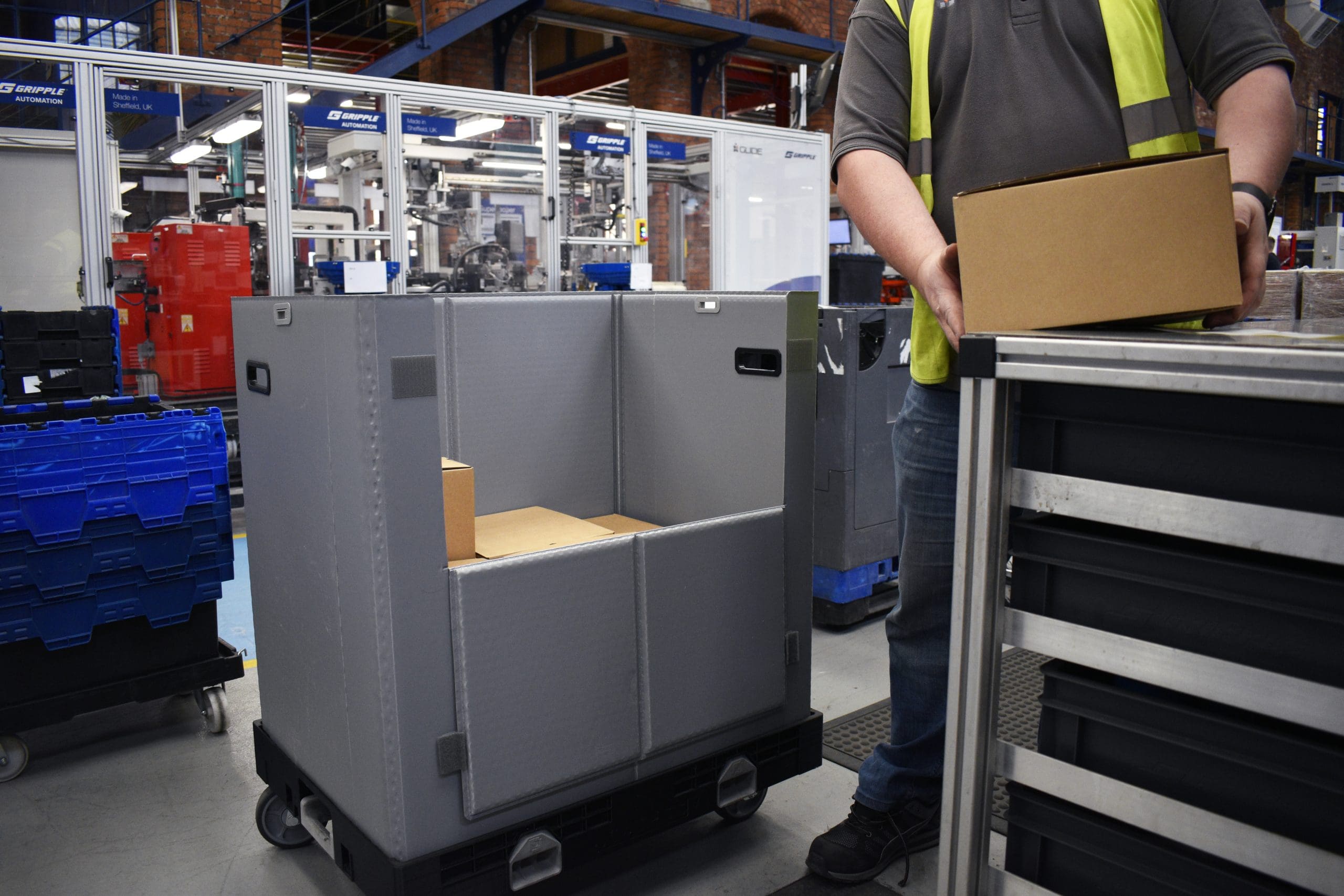 large wheeled container being used in manufacturing warehouse