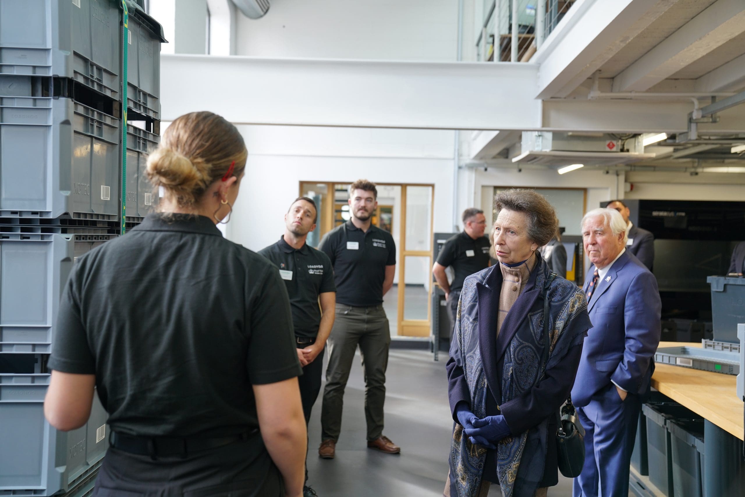 HRH The Princess Royal taking to a Loadhog employee about automation totes