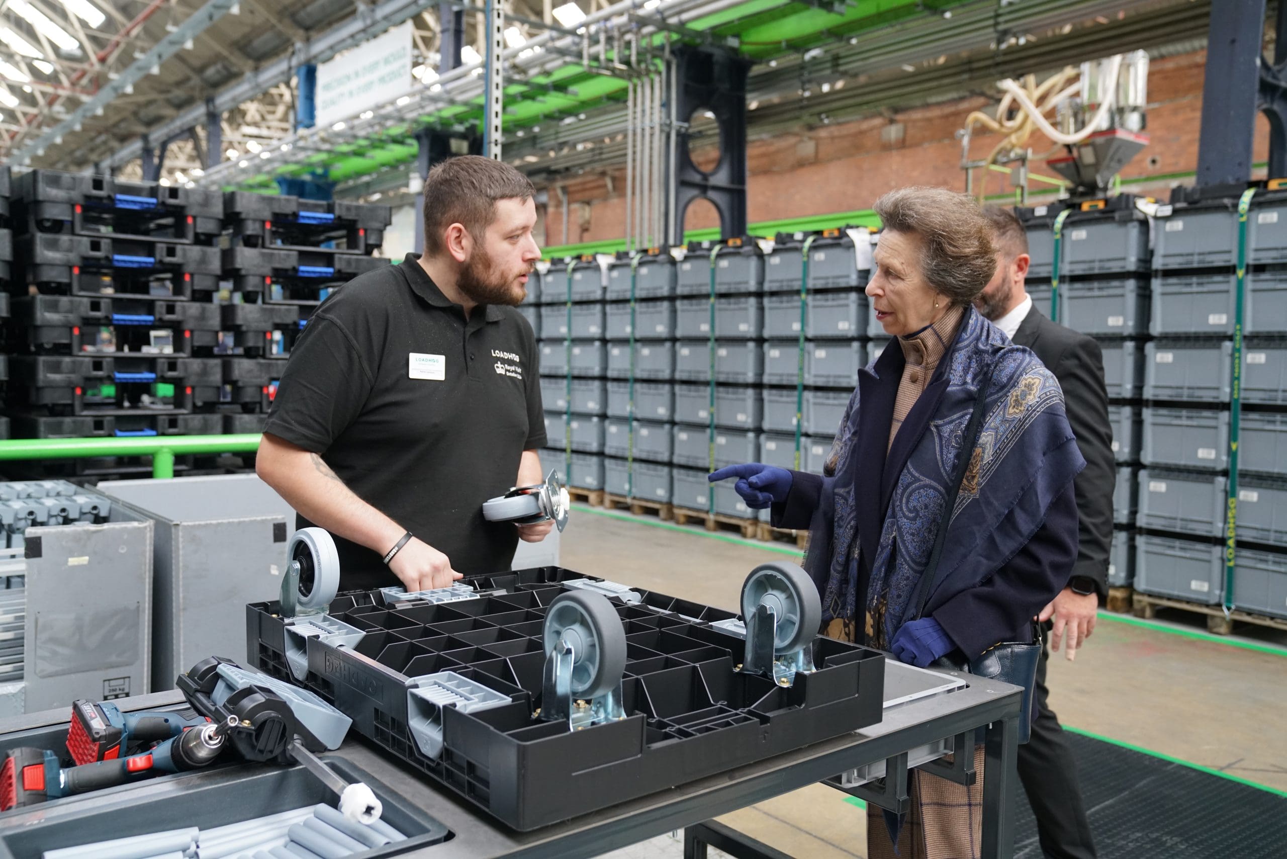 HRH The Princess Royal talking to a Loadhog Employee about the Dolly Max wheeled platform