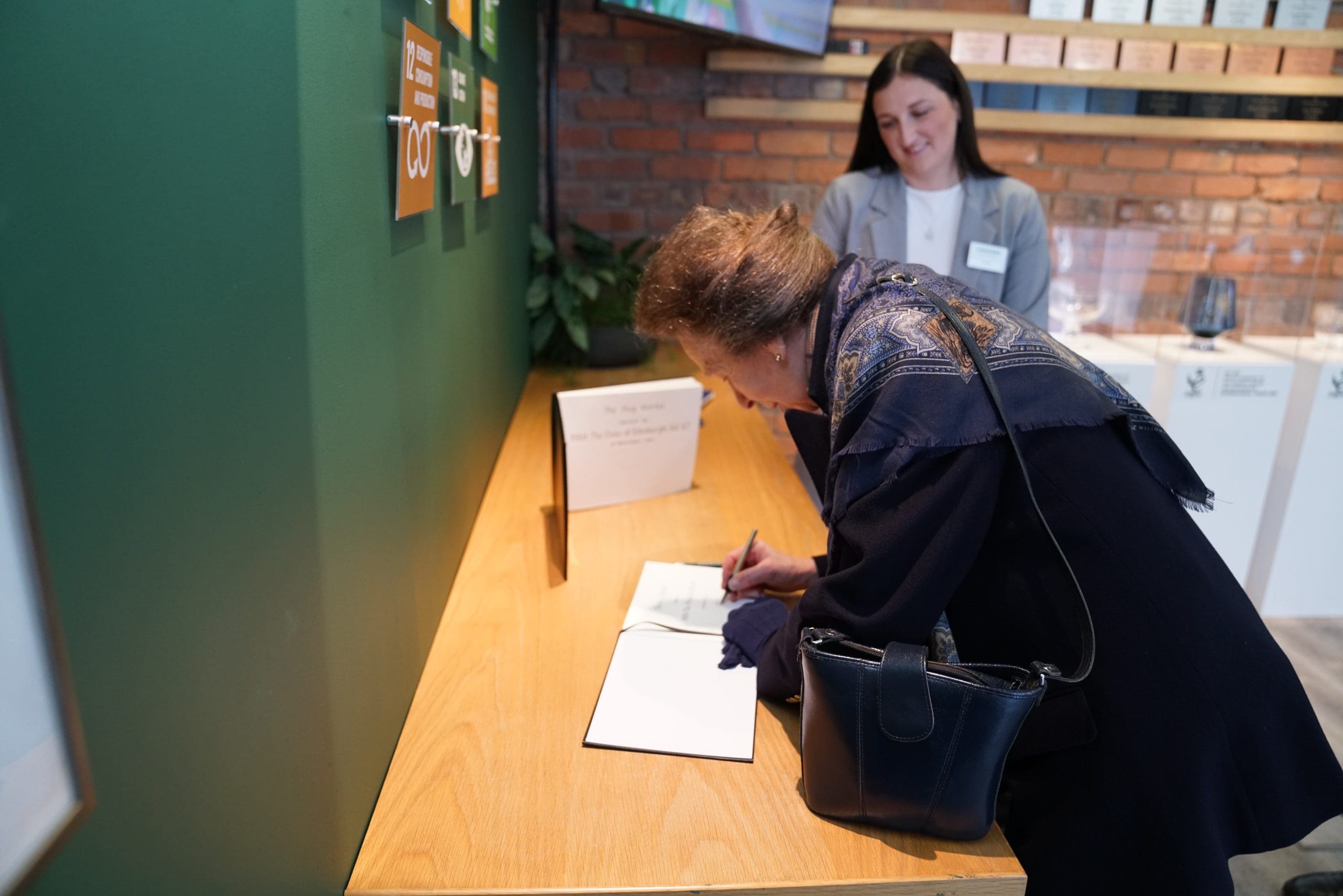 HRH The Princess Royal signing the visitor book at Loadhog, Sheffield