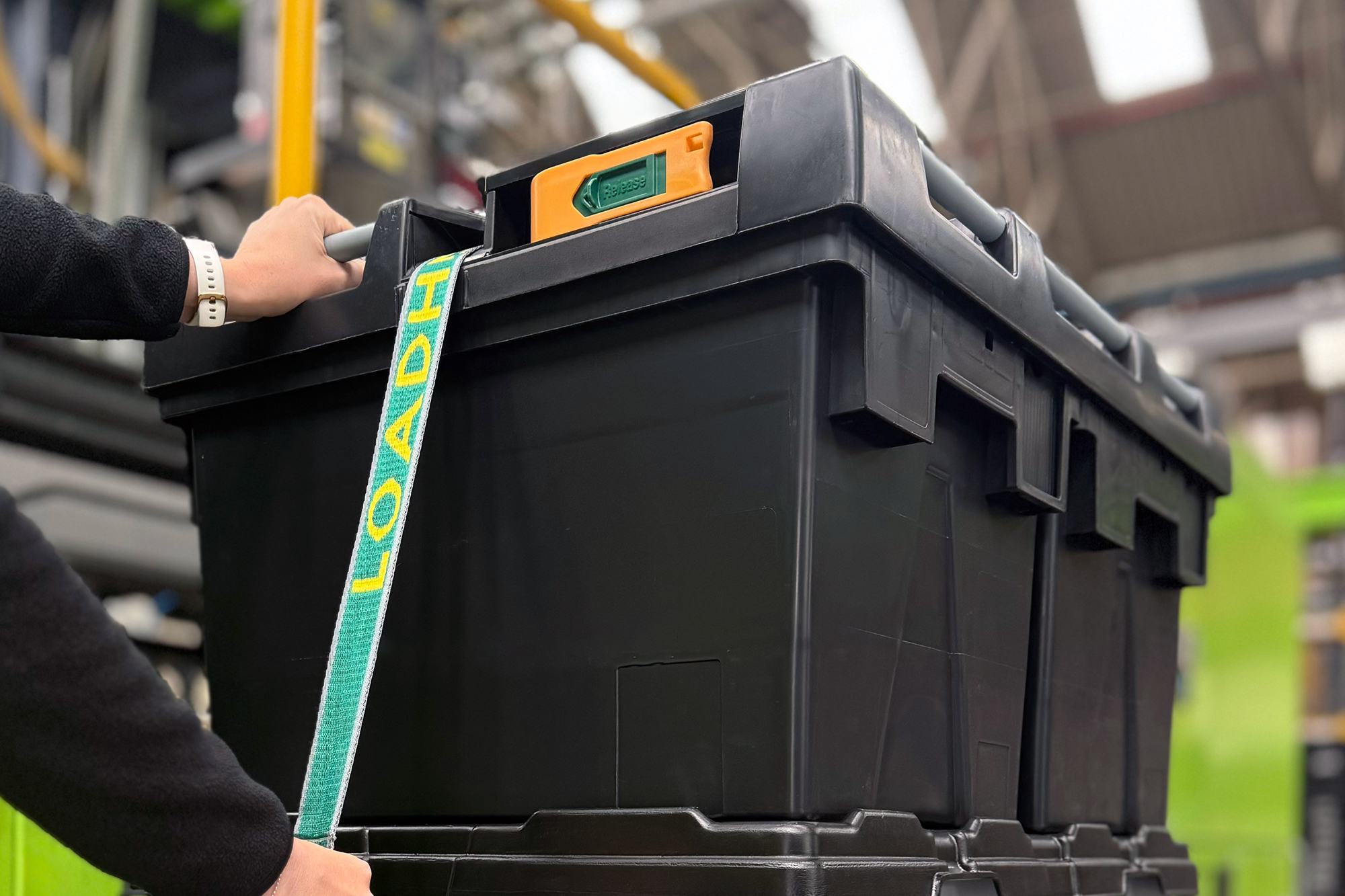 Warehouse operative securing a load with Loadhog’s Half Euro Pallet Lid.
